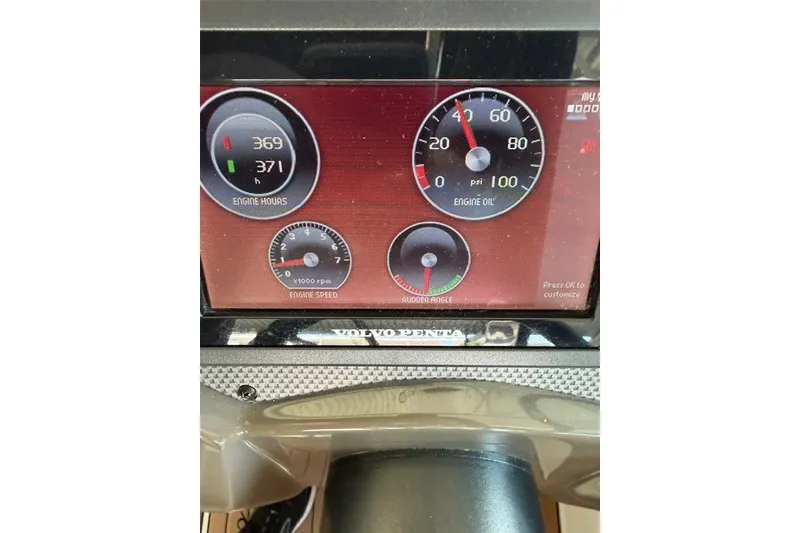 Slide: The Image of Dashboard of 2015 Cruisers Sport Series 328 showing engine hours and oil pressure. - 33