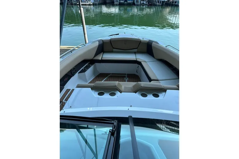 Slide: The Image of 2015 Cruisers Sport Series 328 boat interior with seating and cup holders. - 39