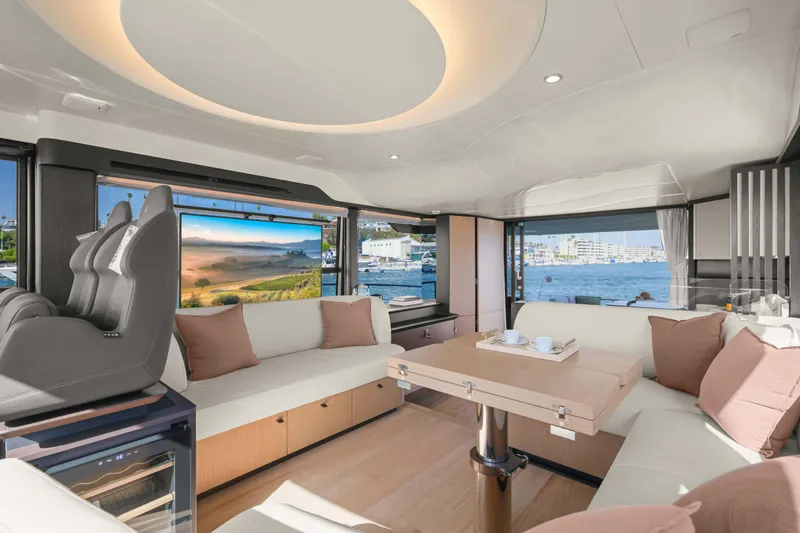 Slide: The Image of Luxurious interior of 2026 Absolute 52 Fly yacht with modern seating and scenic views. - 38