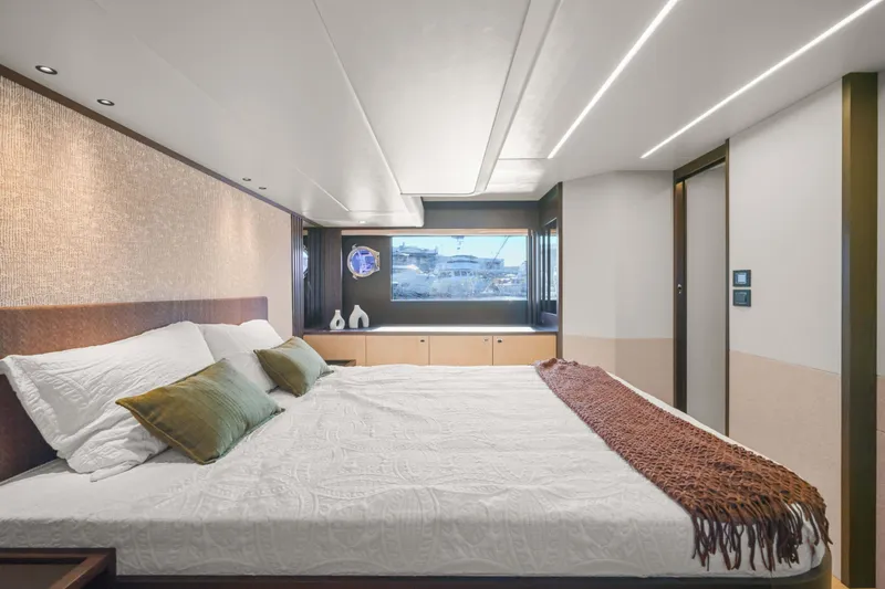 Slide: The Image of Luxurious bedroom interior on the 2026 Absolute 52 Fly yacht, featuring elegant design and modern amenities. - 49
