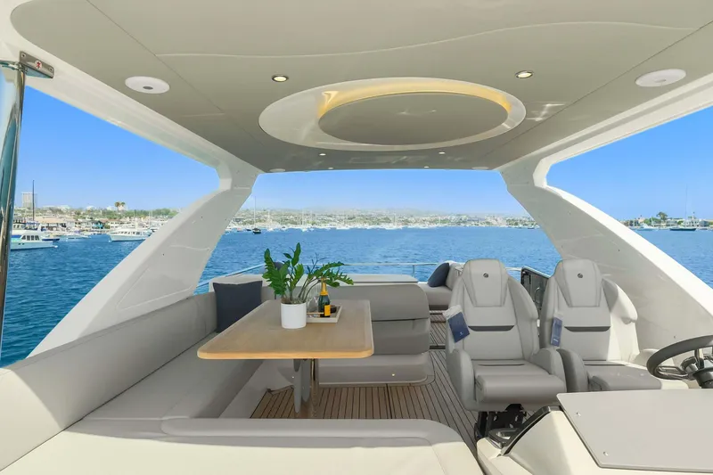 Slide: The Image of Luxurious 2026 Absolute 52 Fly yacht interior with elegant seating and scenic ocean view. - 15