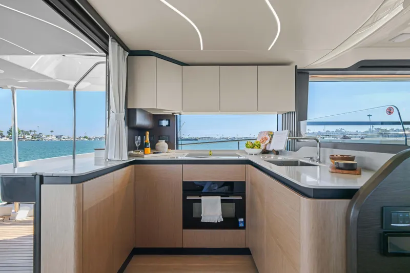 Slide: The Image of Luxurious kitchen interior on 2026 Absolute 52 Fly yacht with ocean view. - 26
