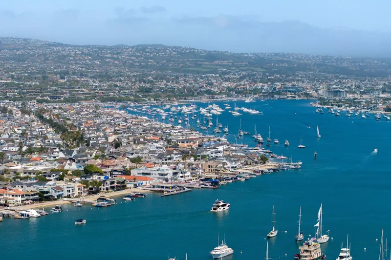 Slide: The Image of Aerial view of a bustling marina with boats, featuring the Absolute 52 Fly yacht, 2026 model. - 63