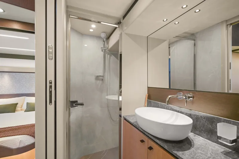 Slide: The Image of Luxurious bathroom interior of 2026 Absolute 52 Fly yacht with modern fixtures and elegant design. - 56