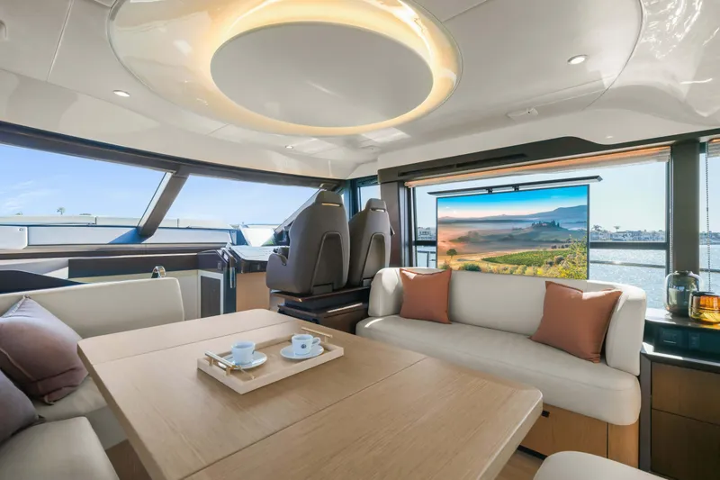 Slide: The Image of Luxurious interior of 2026 Absolute 52 Fly yacht with modern seating and scenic view. - 31