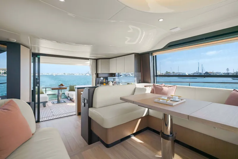 Slide: The Image of Luxurious interior of 2026 Absolute 52 Fly yacht with ocean view and elegant seating. - 23