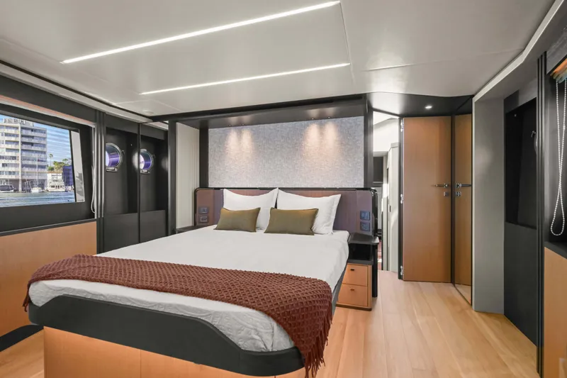 Slide: The Image of Luxurious bedroom interior of 2026 Absolute 52 Fly yacht with modern design and large windows. - 41