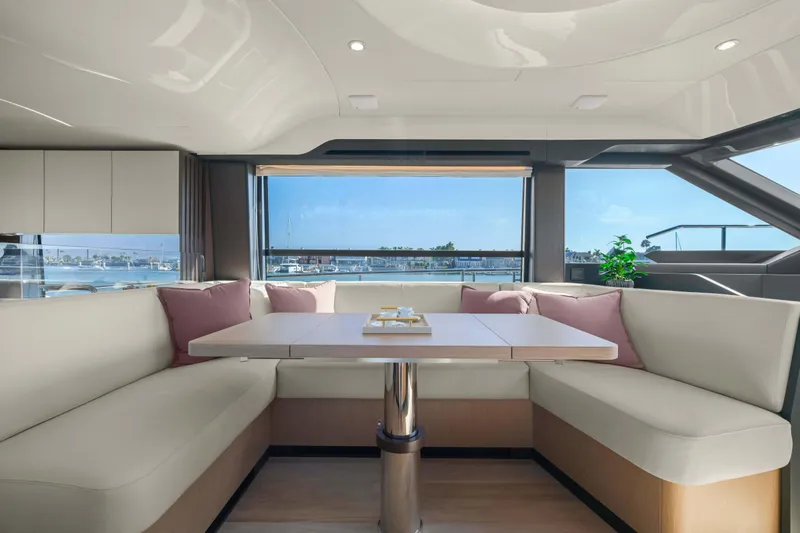 Slide: The Image of Luxurious interior of 2026 Absolute 52 Fly yacht with elegant seating and scenic window view. - 27