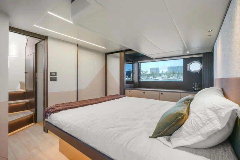 Slide: The Image of Luxurious bedroom interior of 2026 Absolute 52 Fly yacht with modern design and large window view. - 48