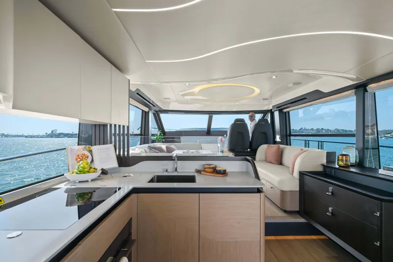 Slide: The Image of Luxurious interior of 2026 Absolute 52 Fly yacht with modern kitchen and scenic ocean view. - 24