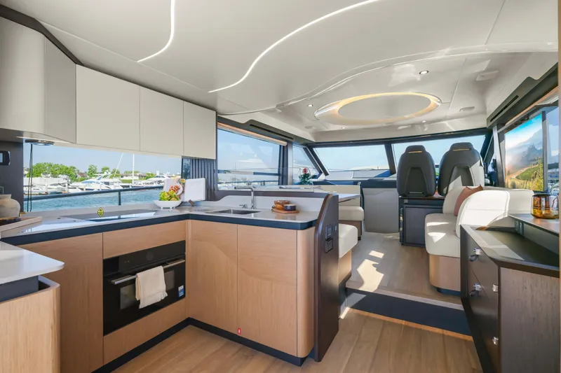 Slide: The Image of Luxurious interior of 2026 Absolute 52 Fly yacht with modern kitchen and seating area. - 30