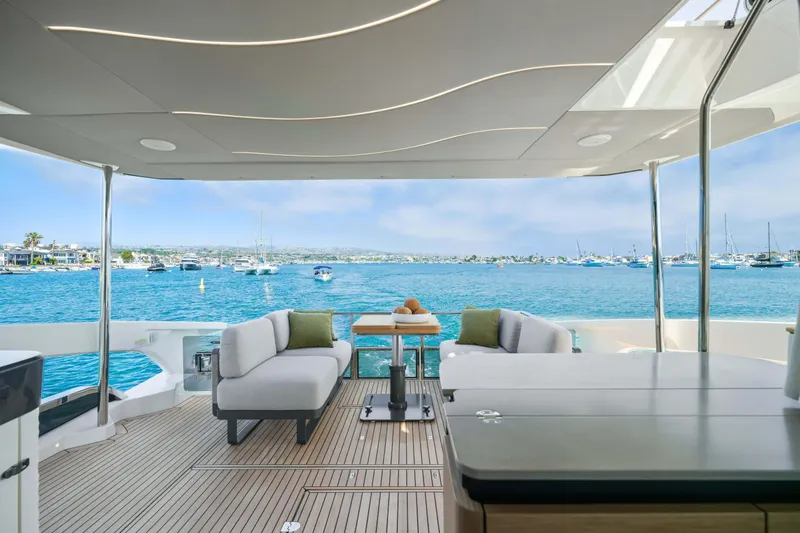 Slide: The Image of Luxurious 2026 Absolute 52 Fly yacht deck with elegant seating and stunning ocean view. - 20