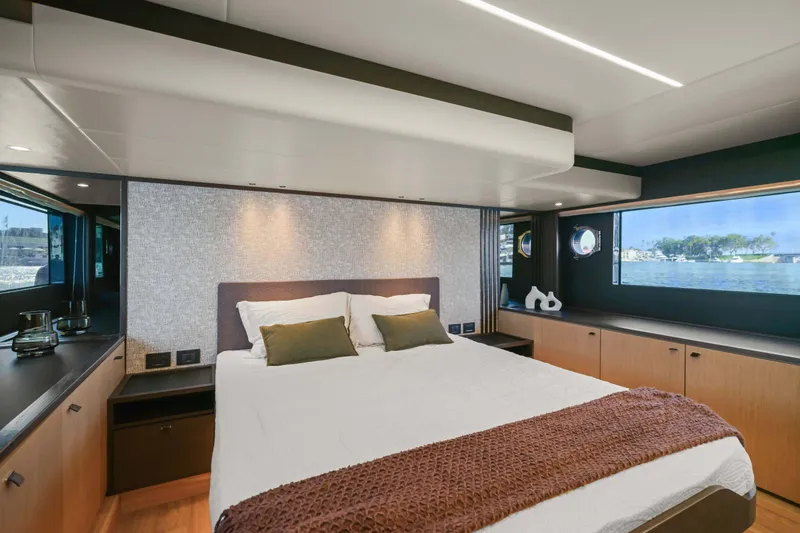 Slide: The Image of Luxurious bedroom interior of 2026 Absolute 52 Fly yacht with scenic window view. - 47