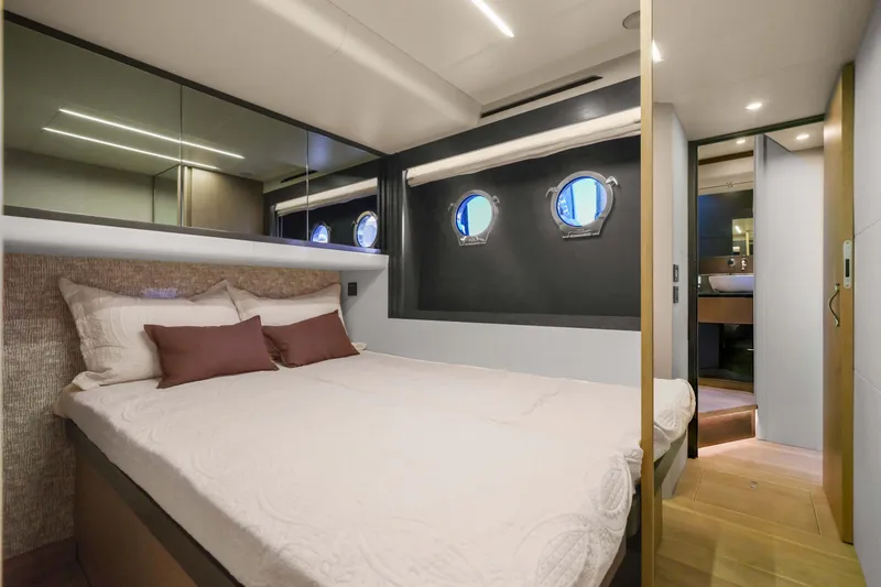 Slide: The Image of Luxurious cabin interior of 2026 Absolute 52 Fly yacht with modern design and porthole windows. - 51