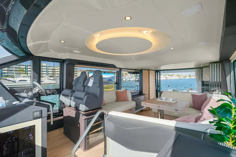 Slide: The Image of Luxurious interior of 2026 Absolute 52 Fly yacht with modern seating and scenic views. - 35