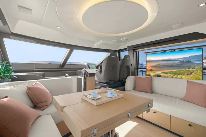 Slide: The Image of Luxurious interior of 2026 Absolute 52 Fly yacht with modern seating and scenic window view. - 39