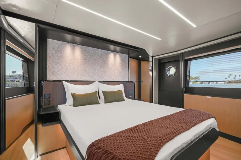 Slide: The Image of Luxurious bedroom interior of 2026 Absolute 52 Fly yacht with modern design and scenic views. - 42