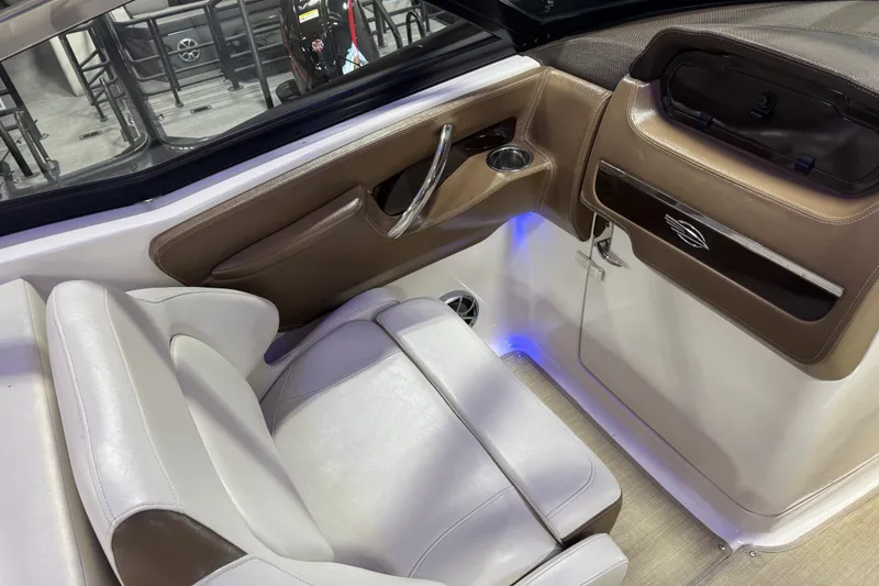 Slide: The Image of Interior of 2016 Chaparral 307 SSX boat with leather seating and modern dashboard. - 12