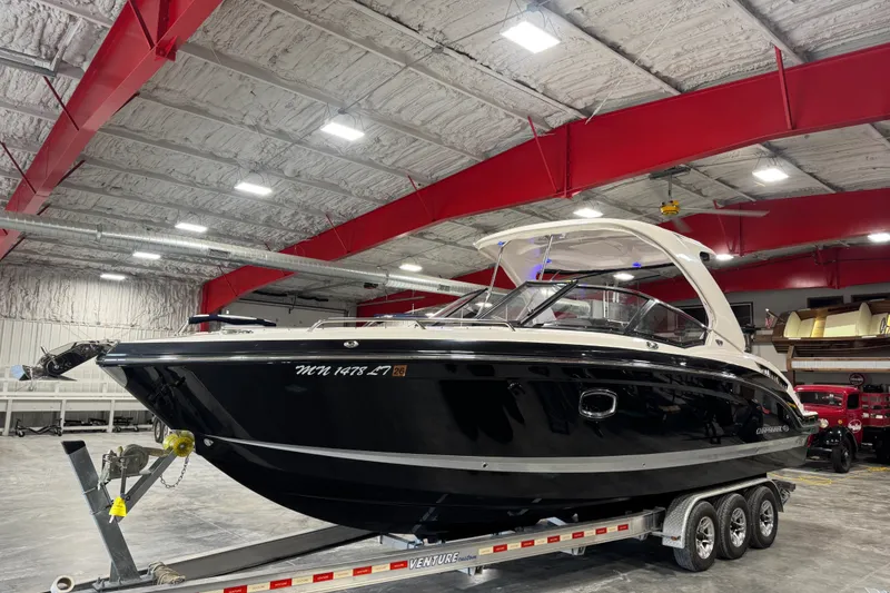 Slide: The Image of 2016 Chaparral 307 SSX boat on trailer in indoor storage facility. - 2