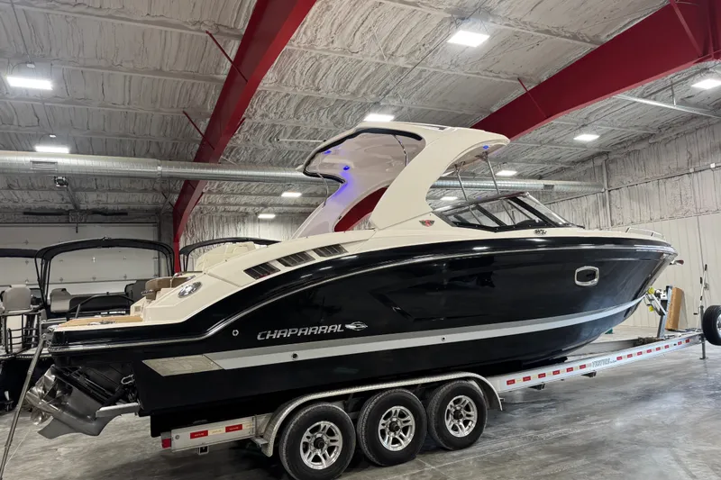 Slide: The Image of 2016 Chaparral 307 SSX boat on trailer in indoor storage facility. - 4