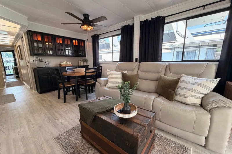 Slide: The Image of Luxurious 1991 Leisure Time 14x63 interior with cozy seating, dining area, and elegant decor. - 19