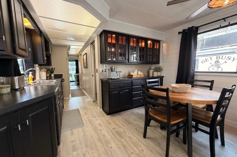 Slide: The Image of Modern kitchen and dining area in a 1991 Leisure Time 14x63 mobile home. - 21