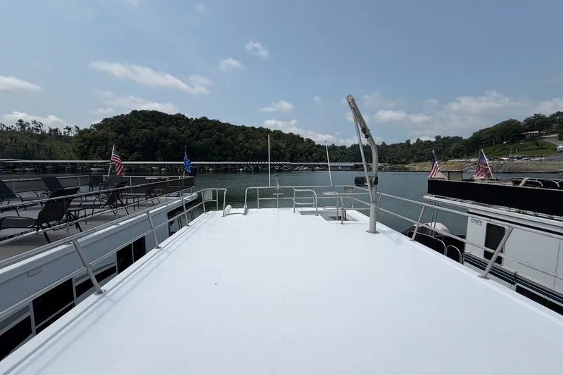 Slide: The Image of Houseboat deck view on a lake, Leisure Time 14x63, 1991 model, with scenic surroundings. - 6