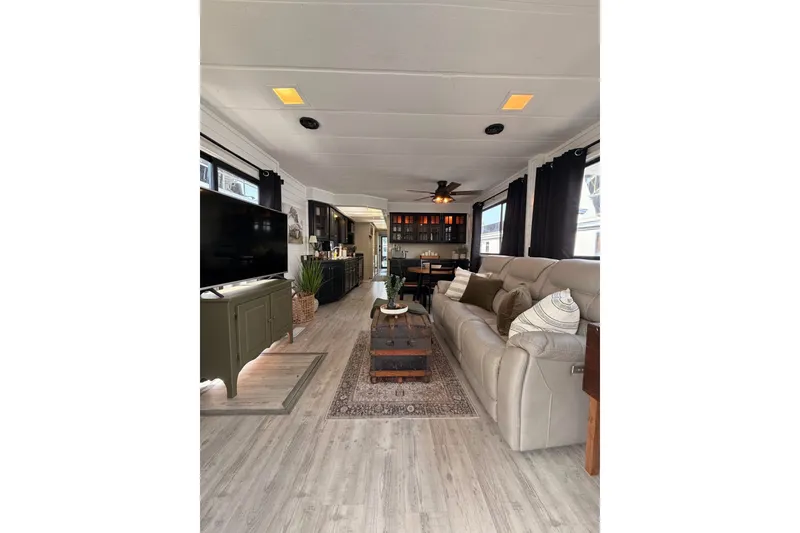 Slide: The Image of Spacious 1991 Leisure Time 14x63 interior with modern decor and comfortable seating. - 12