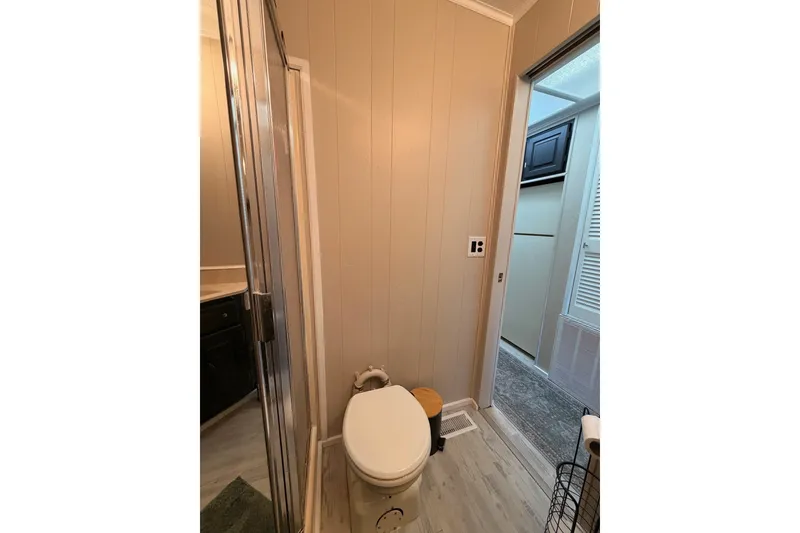 Slide: The Image of Compact bathroom in 1991 Leisure Time model, featuring toilet and shower. - 33