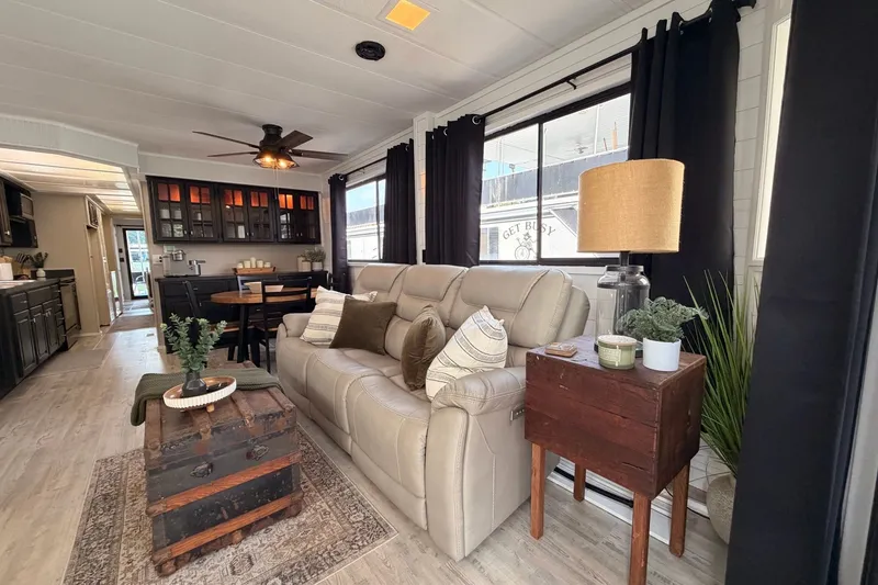 Slide: The Image of Cozy living area in a 1991 Leisure Time 14x63 mobile home with modern decor. - 14