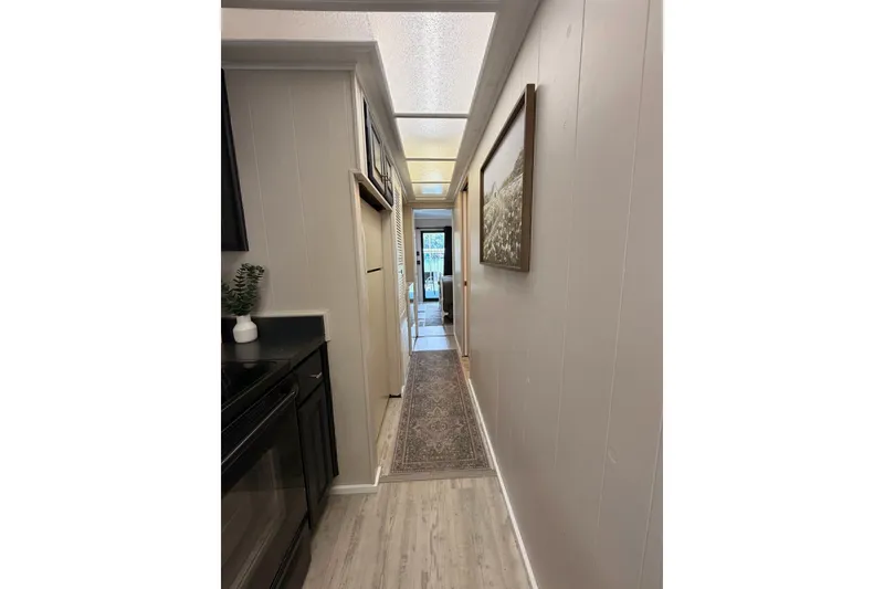 Slide: The Image of Narrow hallway in 1991 Leisure Time model, featuring modern decor and natural lighting. - 29