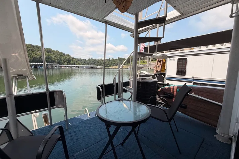 Slide: The Image of Houseboat deck with chairs and table overlooking serene lake, Leisure Time 14x63, 1991 model. - 42