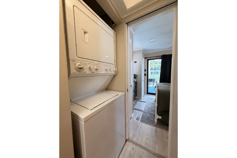 Slide: The Image of Stacked washer and dryer in a 1991 Leisure Time 14x63 mobile home hallway. - 34