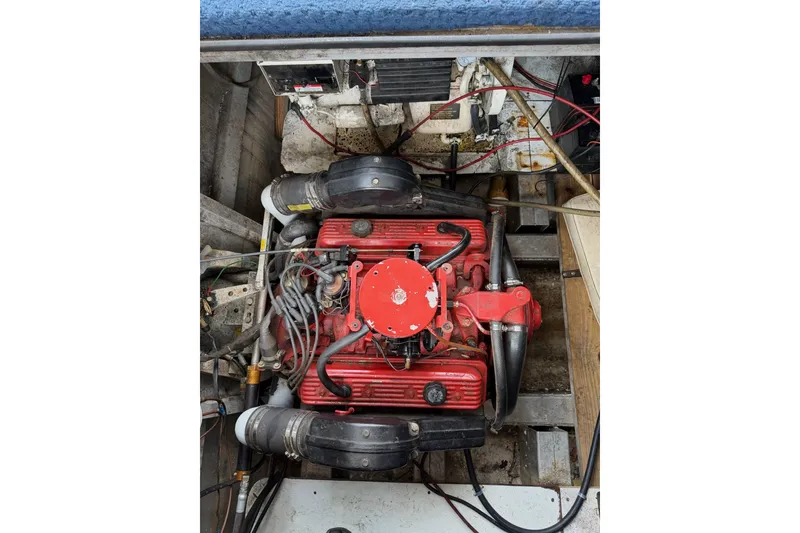 Slide: The Image of Engine compartment of a 1991 Leisure Time 14x63 boat, featuring a red engine. - 44