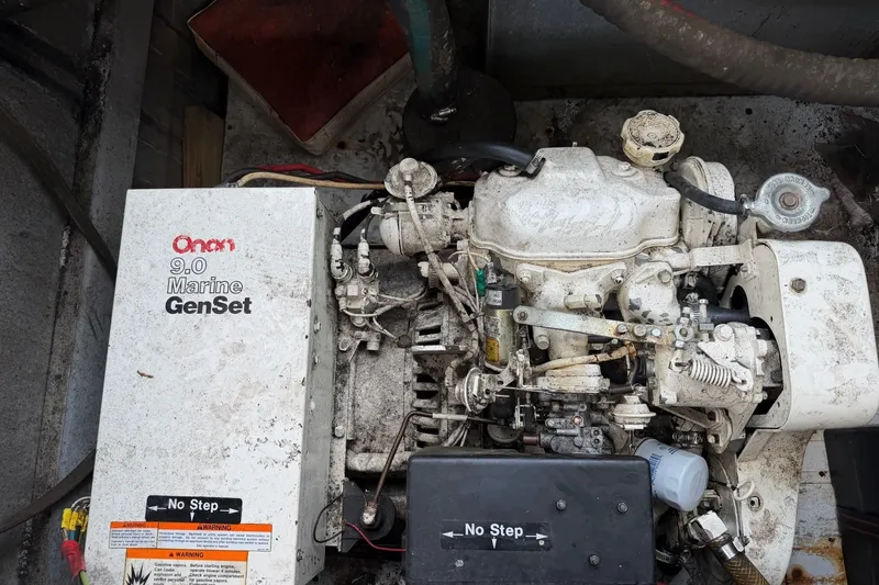 Slide: The Image of Onan 9.0 Marine GenSet engine in a 1991 Leisure Time 14x63 model. - 45