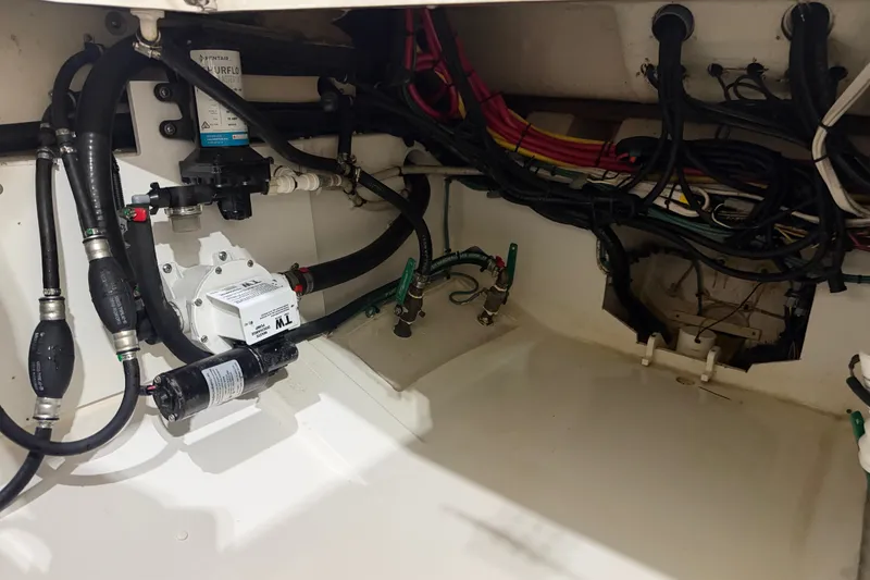 Slide: The Image of 2019 Pursuit DC 325 Dual Console boat wiring and plumbing system. - 39