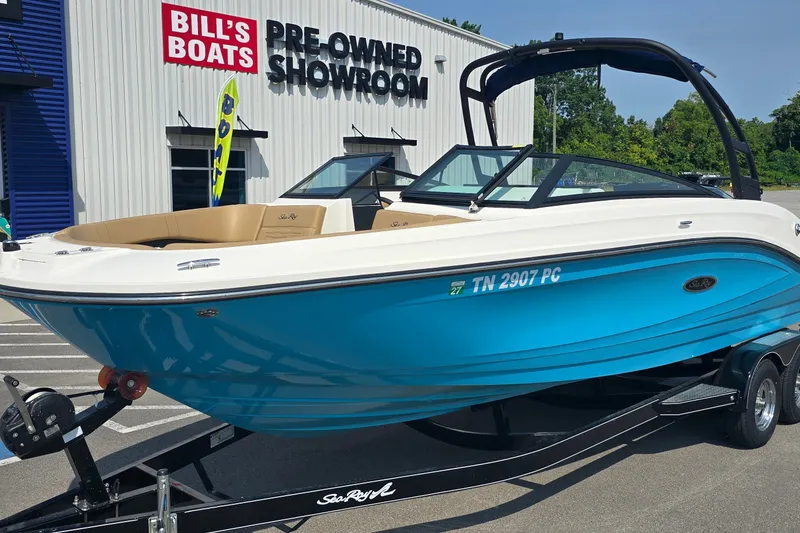 Slide: The Image of 2024 Sea Ray SPX 230 boat displayed at Bill's Boats pre-owned showroom. - 1