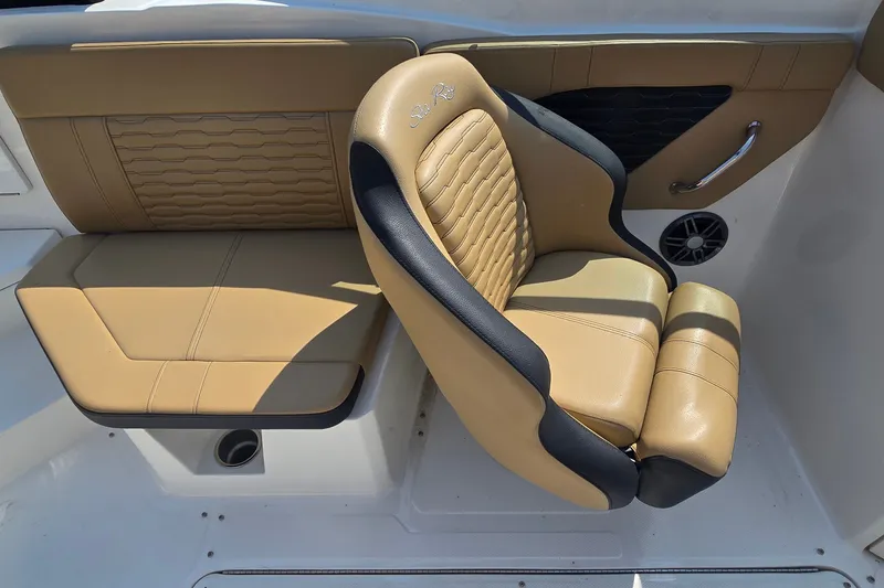 Slide: The Image of 2024 Sea Ray SPX 230 boat interior with tan and black seating. - 11