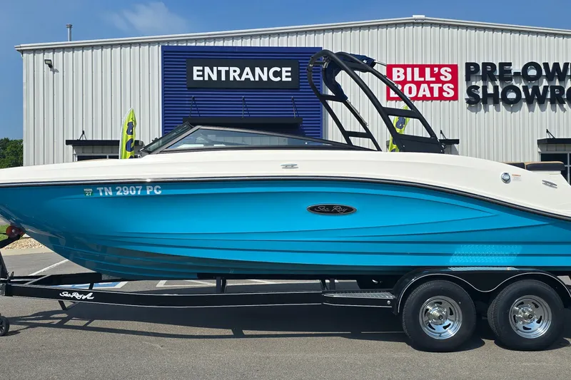The Image of 2024 Sea Ray SPX 230 boat in blue on trailer at Bill's Boats showroom. - 0
