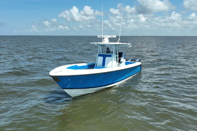 The Image of 2012 Contender 35 ST boat on open water under a partly cloudy sky. - 1