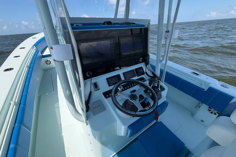Slide: The Image of 2012 Contender 35 ST boat cockpit with advanced navigation system on open water. - 23