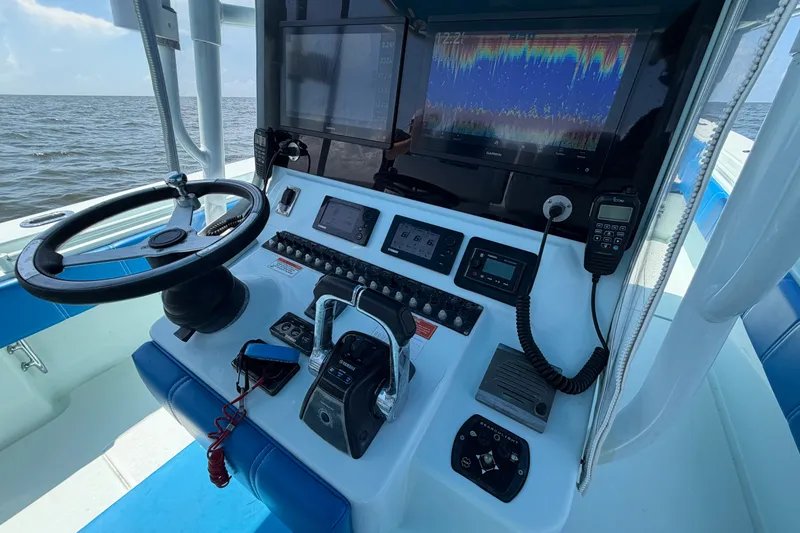 Slide: The Image of 2012 Contender 35 ST boat dashboard with navigation and communication equipment. - 24