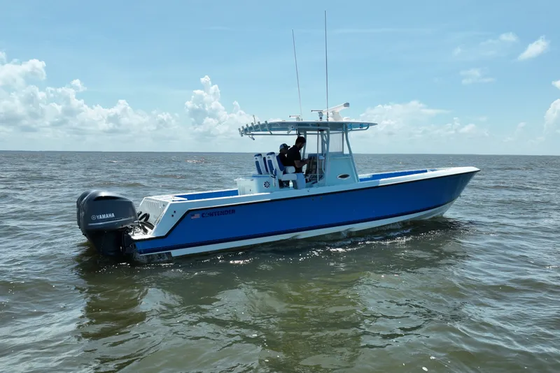Slide: The Image of 2012 Contender 35 ST boat on open water, featuring Yamaha outboard engines. - 8