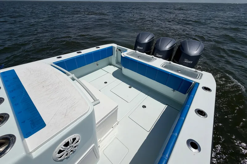 Slide: The Image of 2012 Contender 35 ST boat with triple 300 horsepower engines on open water. - 20