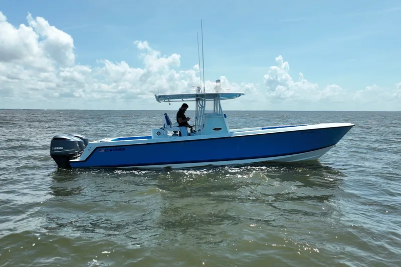 Slide: The Image of 2012 Contender 35 ST boat on open water under a clear sky. - 9