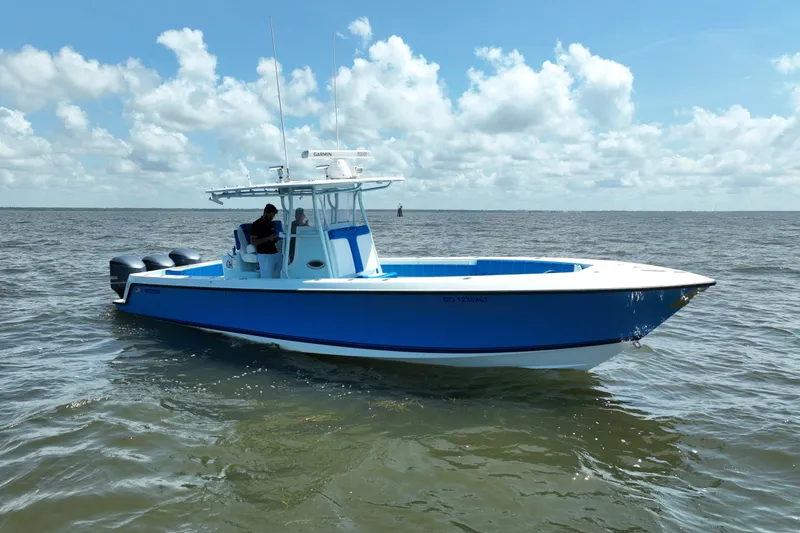 Slide: The Image of 2012 Contender 35 ST boat on open water under a partly cloudy sky. - 10