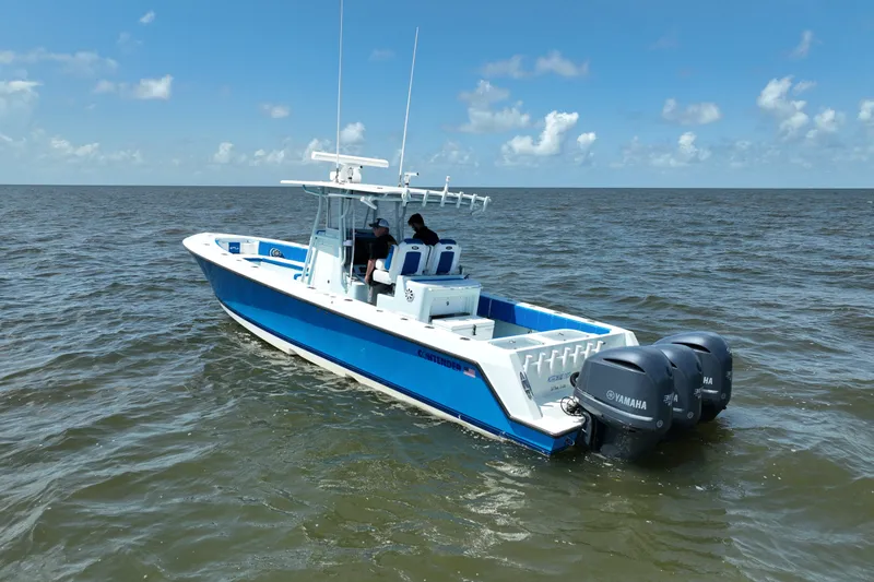 Slide: The Image of 2012 Contender 35 ST boat with Yamaha engines on open water. - 5