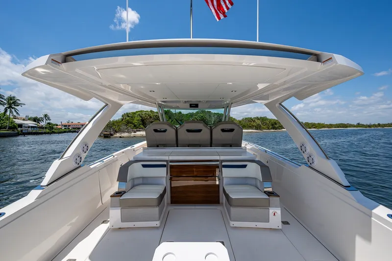 Slide: The Image of 2024 Tiara Yachts 38 LS luxury boat interior with seating, on a sunny day. - 31