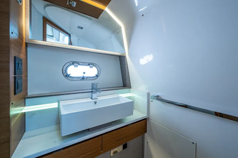 Slide: The Image of Luxurious bathroom interior of 2024 Tiara Yachts 38 LS with modern sink and mirror. - 46