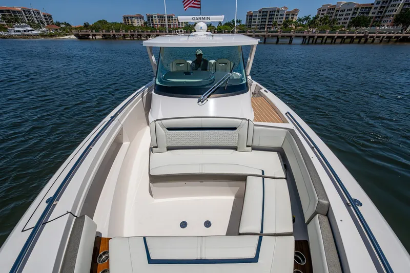 Slide: The Image of 2024 Tiara Yachts 38 LS luxury boat with spacious seating on calm water. - 20